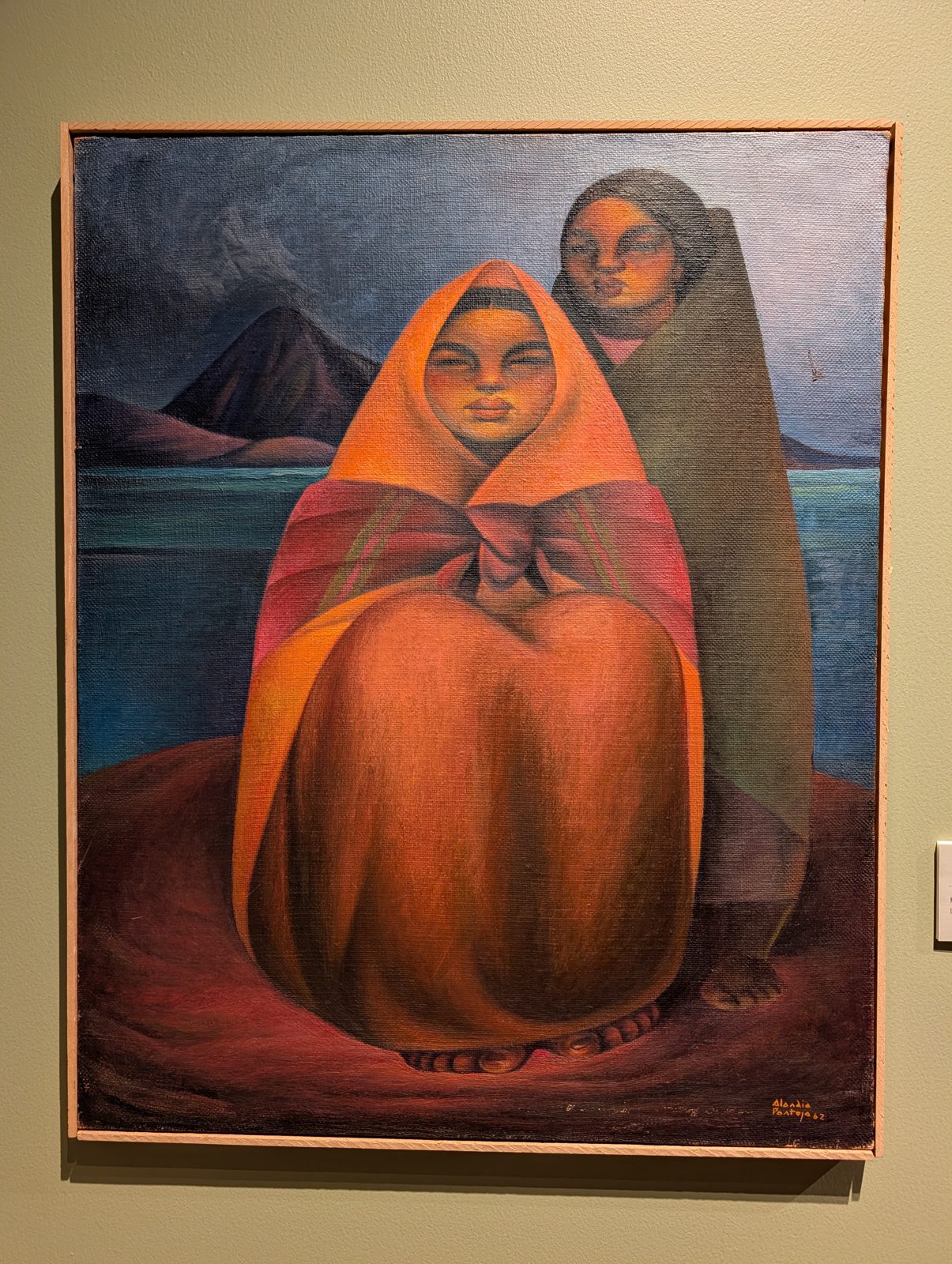 Mother and child, in a shawl the color of the altiplano at sunset.