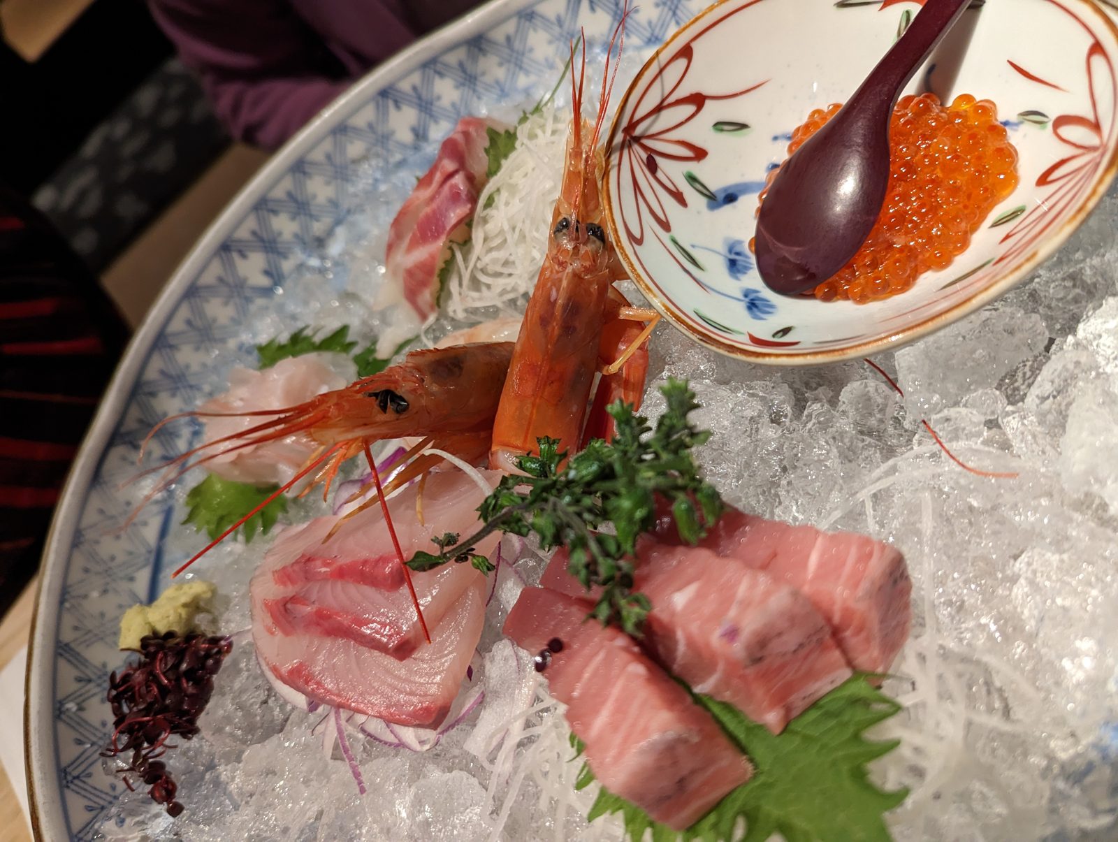 Sashimi and ikura, with the shrimp still looking at you.
