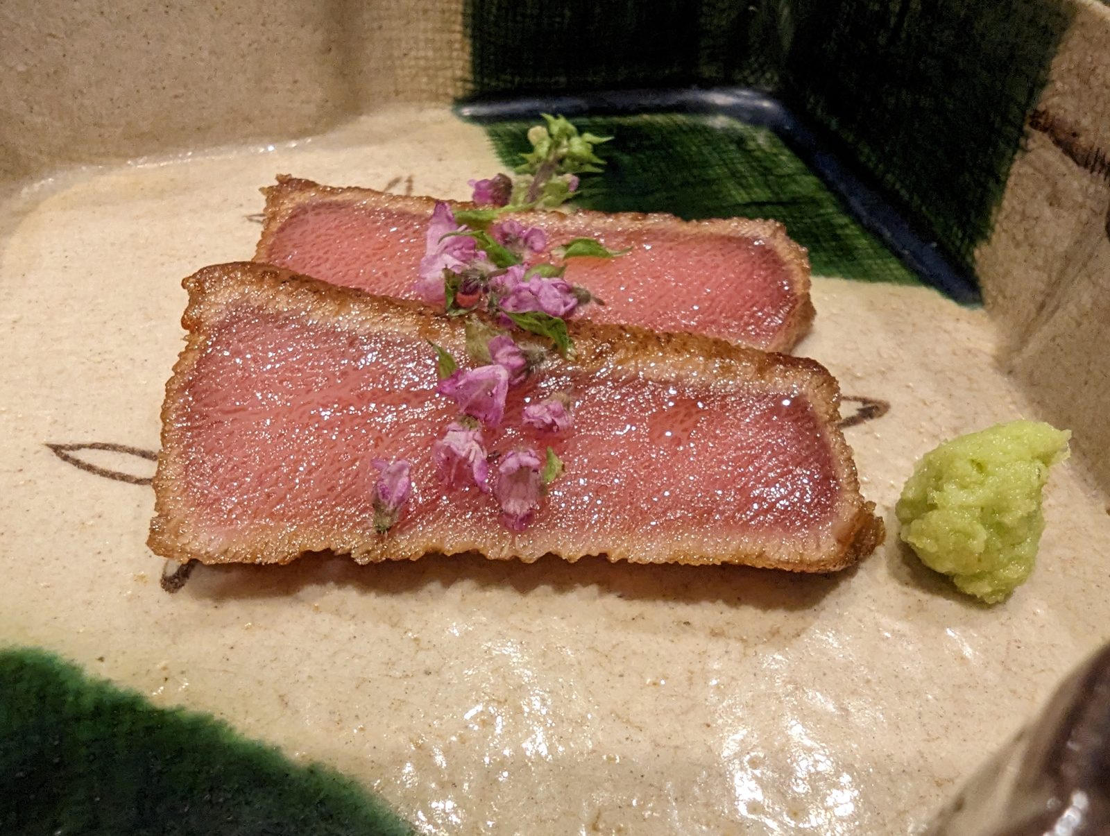 Beef, seared, with sakura on top.