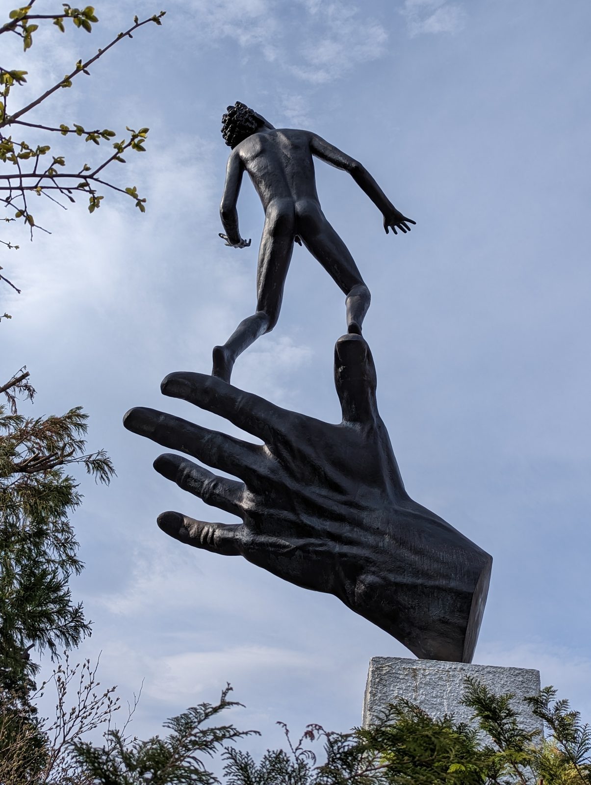 Carl Milles, Hand of God. A man balancing on the fingers.