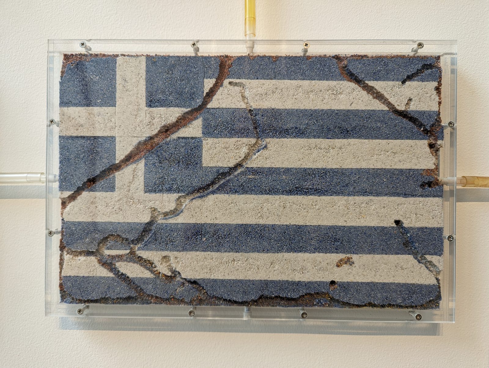 Flags in soil: Greece.